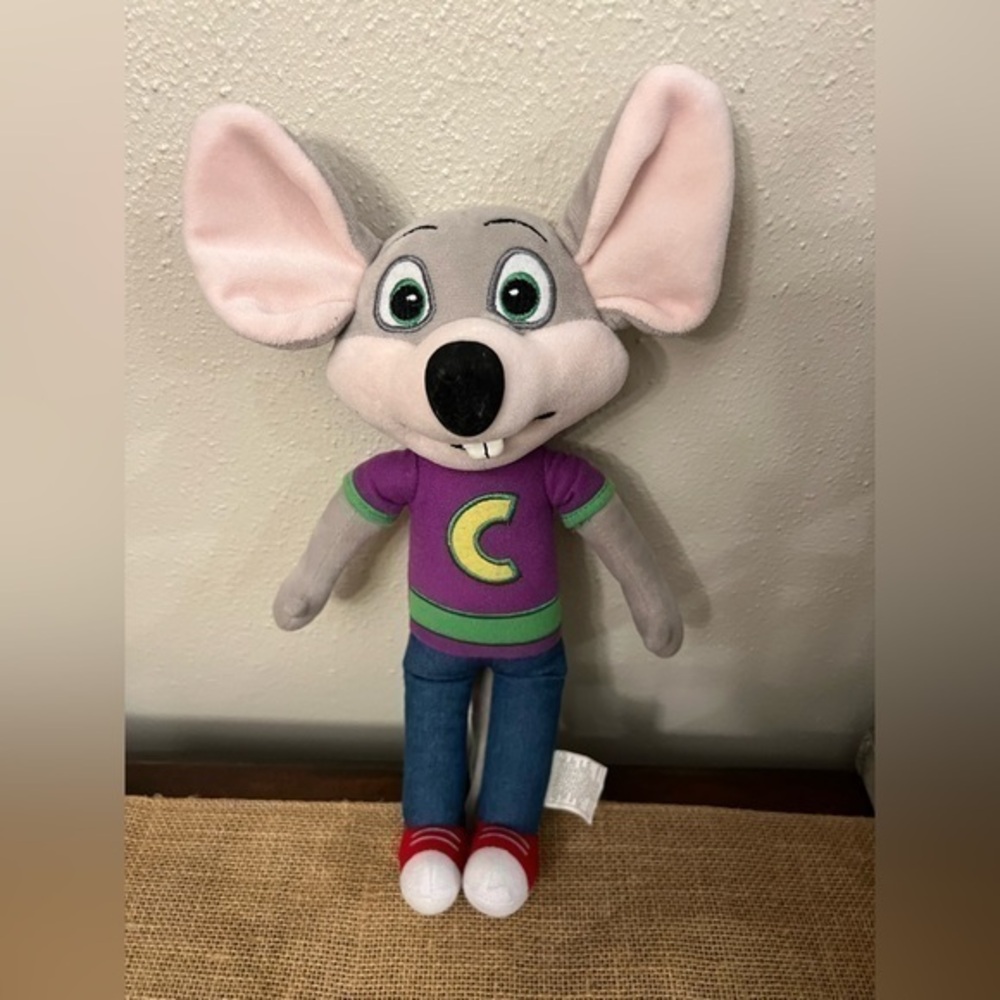 Chuck E Cheese plush doll.
